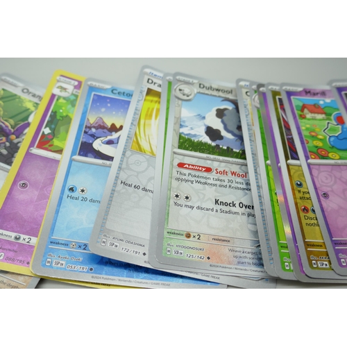 2249 - A large collection of Pokémon cards with holographic in collectors tin, no energy cards