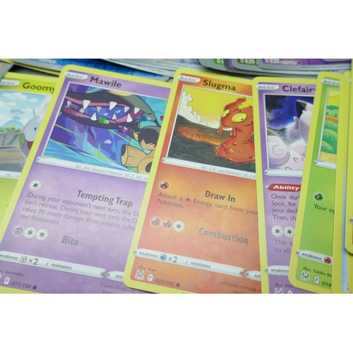 2249 - A large collection of Pokémon cards with holographic in collectors tin, no energy cards