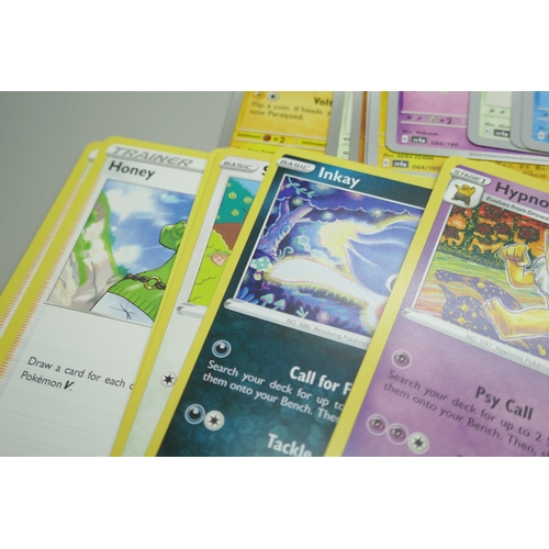 2249 - A large collection of Pokémon cards with holographic in collectors tin, no energy cards