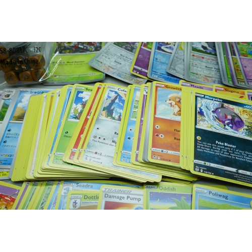 2249 - A large collection of Pokémon cards with holographic in collectors tin, no energy cards