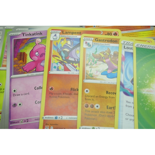 2250 - A large collection of Pokémon cards with holographic in collectors tin, no energy cards