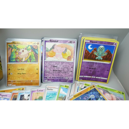 2251 - A large collection of Pokémon cards with holographic in collectors tin, no energy cards