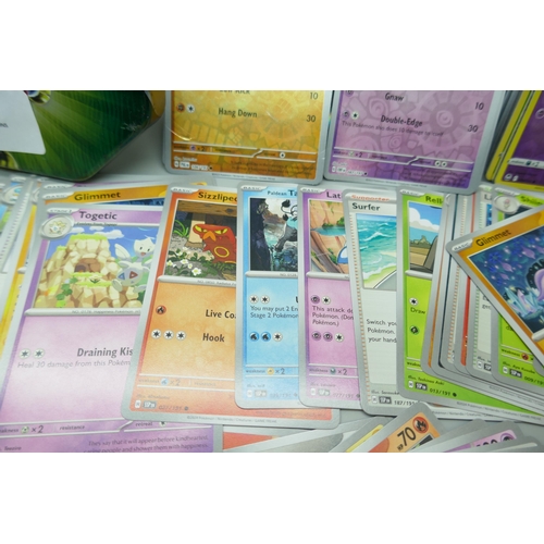 2251 - A large collection of Pokémon cards with holographic in collectors tin, no energy cards