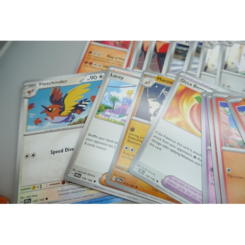 2251 - A large collection of Pokémon cards with holographic in collectors tin, no energy cards