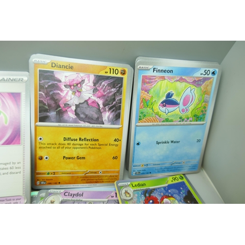 2259 - A large collection of Pokémon cards with holographic in collectors tin, no energy cards