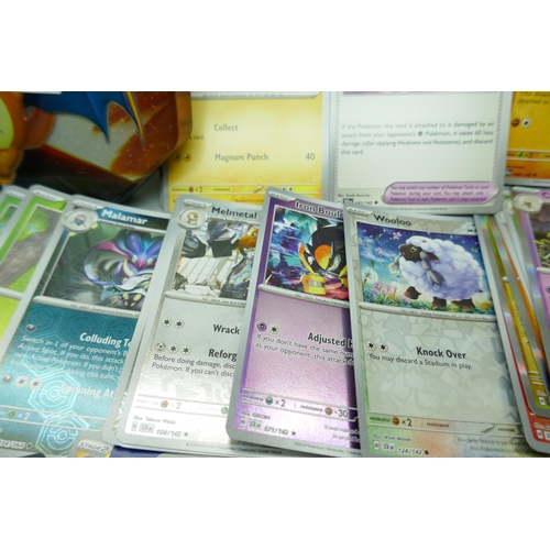 2259 - A large collection of Pokémon cards with holographic in collectors tin, no energy cards