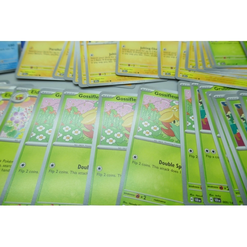 2259 - A large collection of Pokémon cards with holographic in collectors tin, no energy cards