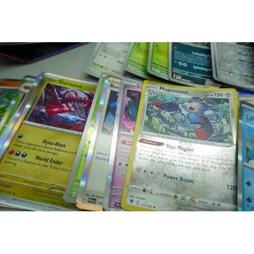 2259 - A large collection of Pokémon cards with holographic in collectors tin, no energy cards