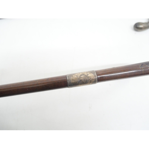 2269 - Two walking sticks: Leader of London with silver collar and a wooden silver tipped stick