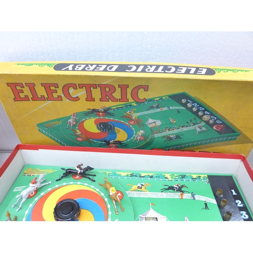 2326 - A Waddingtons Totopoly game, as new, a Kay London Electric Derby game, Etch a Sketch in original box... 