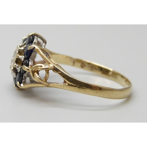 7015 - A 9ct gold, blue stone and diamond cluster ring, 1.4g, L