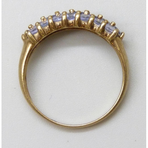 7016 - A 9ct gold three row iolite ring, 2.6g, Q