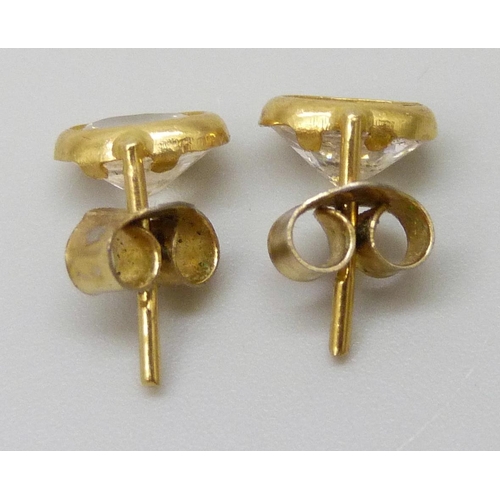 7024 - A pair of 18ct gold earrings set with white paste stones, gilt butterflies, total weight 1.3g