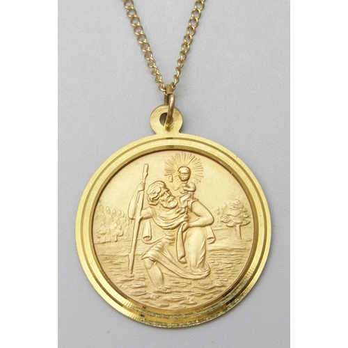 7026 - A 9ct gold St Christopher pendant, 3.3cm including bale, on a 9ct gold chain, 6.8g total