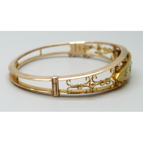 7029 - A Victorian rose and yellow gold 15ct bangle set with old cut diamonds and emeralds, 15.5g, 5.8 x 4.... 