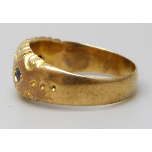 7036 - An 18ct gold ring set with blue stones and diamonds, lacking one stone, 2.9g, K