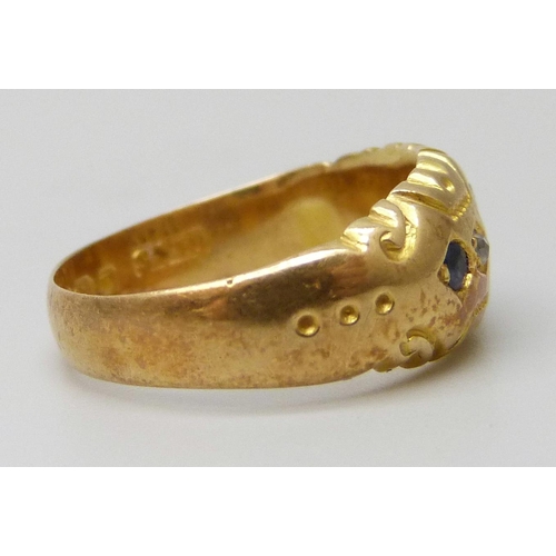 7036 - An 18ct gold ring set with blue stones and diamonds, lacking one stone, 2.9g, K