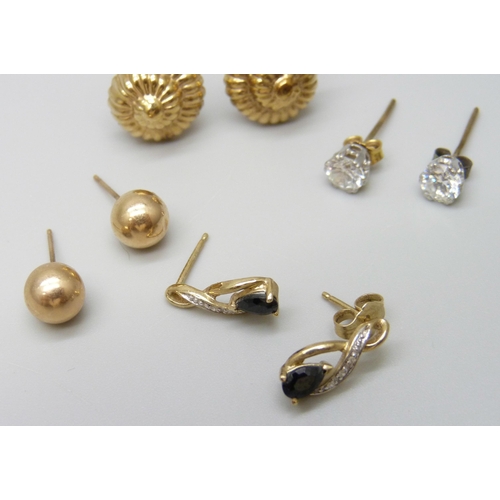 7037 - A pair of yellow metal shell stud earrings, 1.4g, together with three pairs of marked 9ct gold earri... 