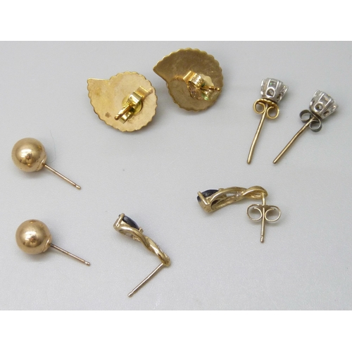 7037 - A pair of yellow metal shell stud earrings, 1.4g, together with three pairs of marked 9ct gold earri... 