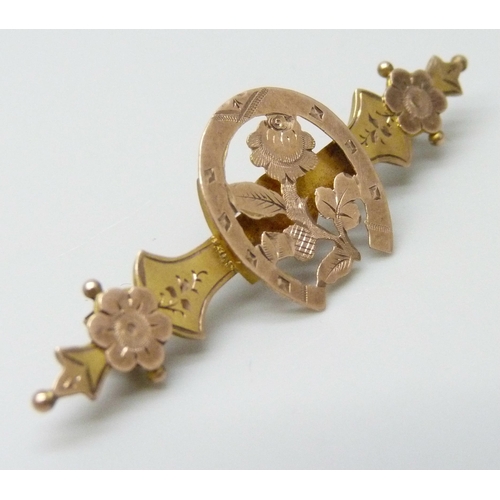 7042 - A Victorian 9ct gold bar brooch with horseshoe and floral design, metal pin, 1.7g, 4.5cm