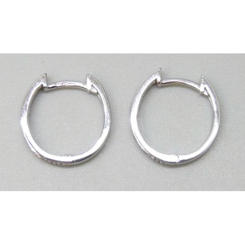 7047 - A pair of 9ct white gold hoop earrings set with diamonds, 1.5g, 1.3cm