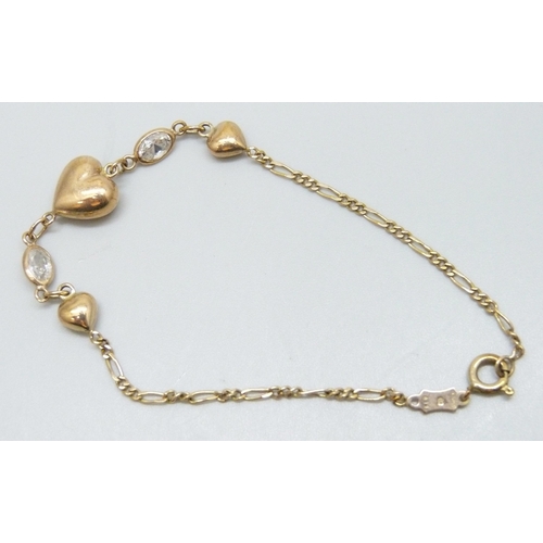 7049 - A 9ct gold bracelet set with white past stones and heart detail, 2.8g, 18cm