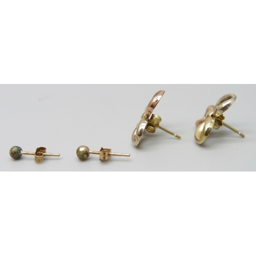 7055 - A pair of yellow metal earrings, 0.7g, and another pair of stud earrings