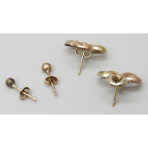 7055 - A pair of yellow metal earrings, 0.7g, and another pair of stud earrings