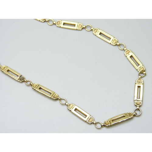 7084 - A yellow metal hollow fancy link chain, replacement fastener, some links dented, 13.1g, 46cm