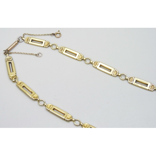 7084 - A yellow metal hollow fancy link chain, replacement fastener, some links dented, 13.1g, 46cm