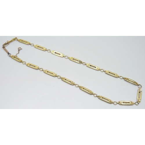 7084 - A yellow metal hollow fancy link chain, replacement fastener, some links dented, 13.1g, 46cm