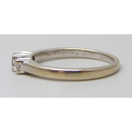 7090 - An 18ct white gold and three princess cut diamond ring, inner shank bears inscription, 2.8g, L