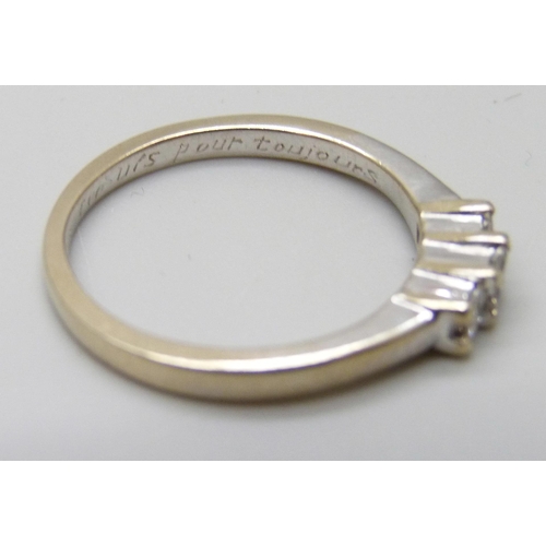 7090 - An 18ct white gold and three princess cut diamond ring, inner shank bears inscription, 2.8g, L