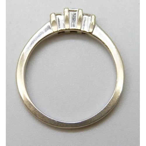 7090 - An 18ct white gold and three princess cut diamond ring, inner shank bears inscription, 2.8g, L