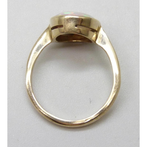 7094 - A 9ct gold opal set ring, 2.1g, J