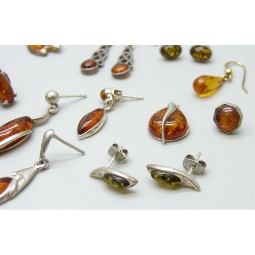 7101 - Four pairs of silver and amber earrings, two pairs of white metal and amber earrings, together with ... 