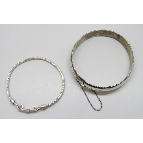 7111 - Two silver bangles, 22g total