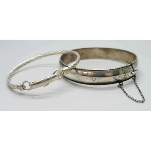 7111 - Two silver bangles, 22g total