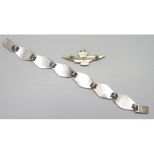 7121 - A silver RAF brooch and an RAF bracelet dated 1945