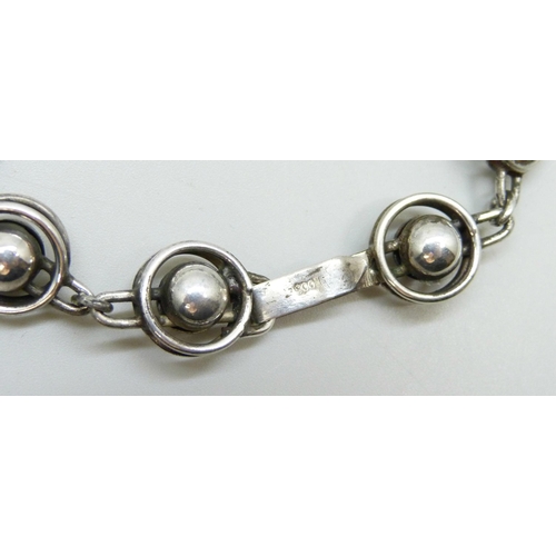 7122 - A .900 silver Modernist style bracelet, 22g, 22.5cm