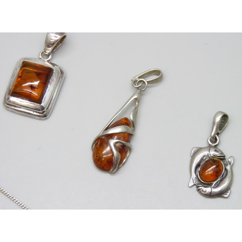 7130 - Five silver and amber pendants, one on a silver chain, 19g total weight