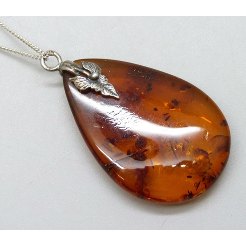 7130 - Five silver and amber pendants, one on a silver chain, 19g total weight