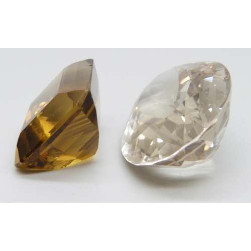 7170 - Two large citrines/smoky quartz, total weight over 141 carats, yellow example chipped