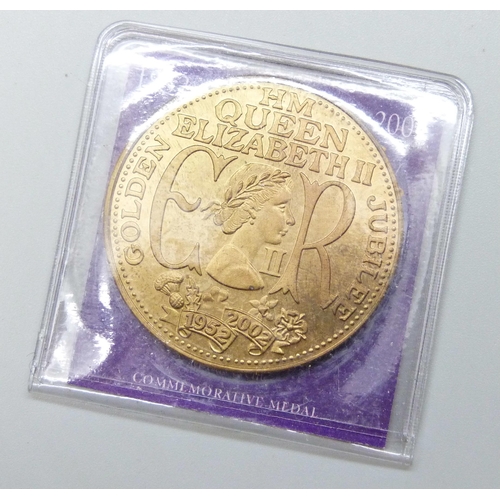 7258 - The Royal Mint Queen Elizabeth II 2002 Golden Jubilee £5 brilliant uncirculated set in folder, toget... 