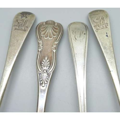 7292 - Three Georgian silver serving spoons, 170g, and a plated example