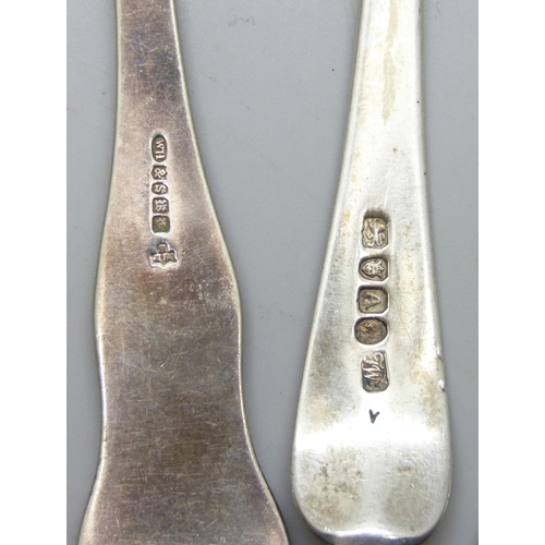 7292 - Three Georgian silver serving spoons, 170g, and a plated example