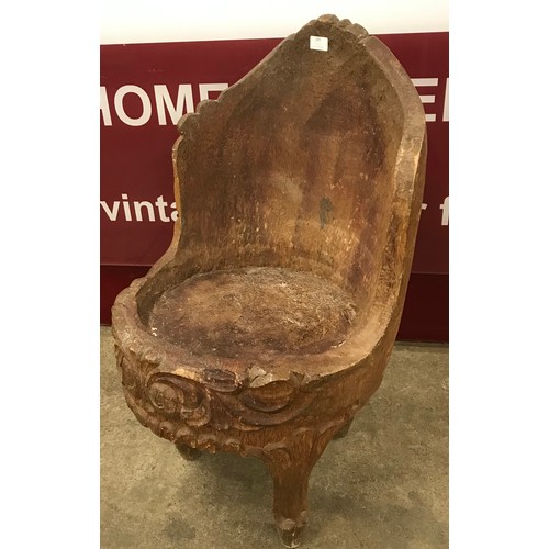 185 - An Anglo-Indian carved oak tub chair, depicting a mythical beast to back