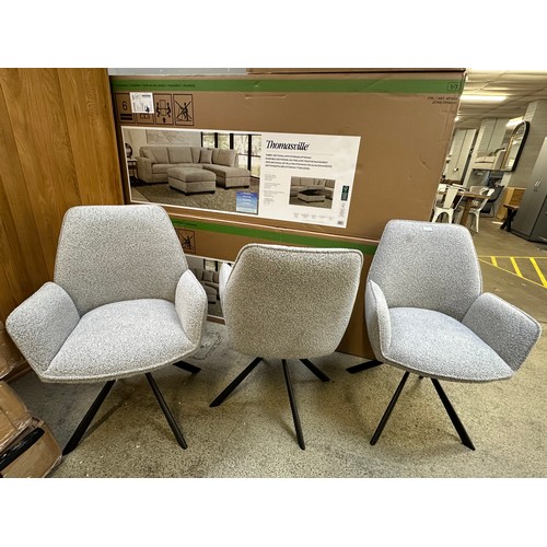 3271 - A set of three boucle swivel dining chairs *This lot is subject to VAT