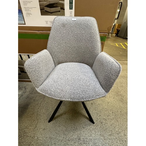 3271 - A set of three boucle swivel dining chairs *This lot is subject to VAT