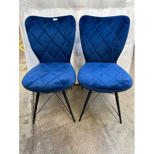 3355 - A pair of navy blue velvet dining chairs *This lot is subject to VAT